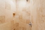 Custom tile work in guest bathroom is a true luxury
